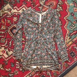 Floral boutique romper with lace up detail